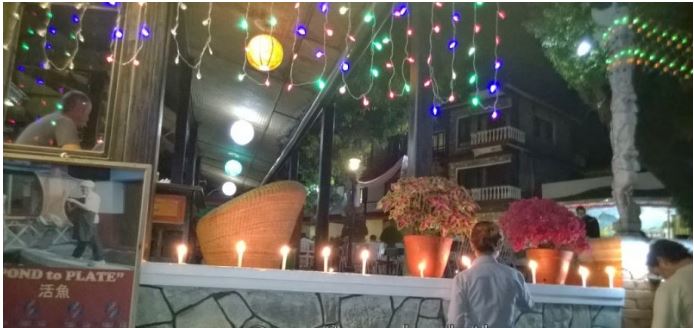 Lighting up candles to celebrate Tihar at Lake View Resort in Pokhara