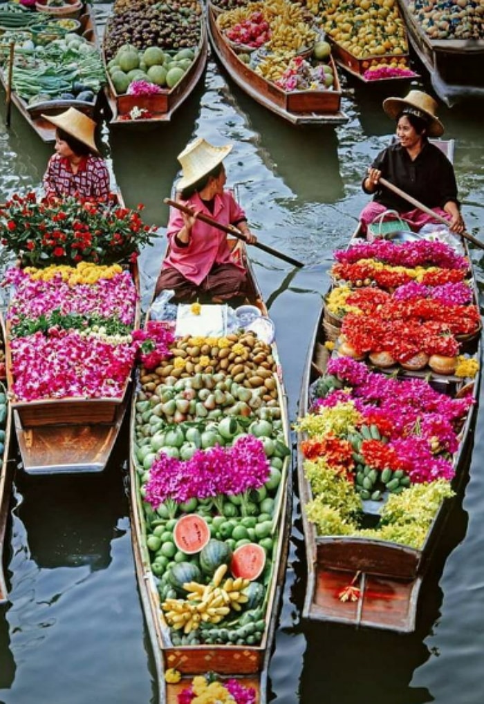 Different kinds of market on river floating market